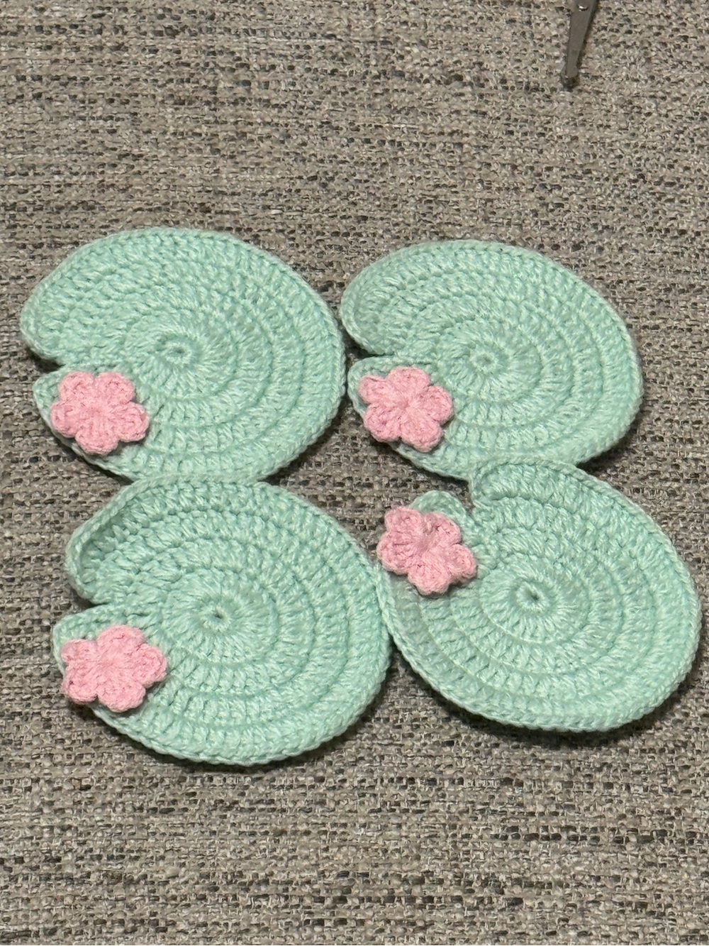 Handmade Mint Crochet Coasters with Pink Flower Accent